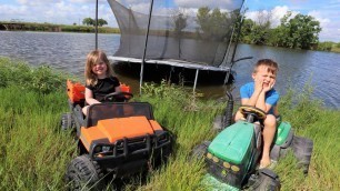 'Using tractors on the farm to play in the water | Tractors for kids'