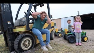 'Using kids tractors to save stuck forklift in the mud | Tractors for kids'