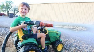 'Playing with a firehose on the farm with tractors | Tractors for kids'