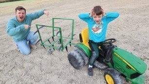 'Using kids tractor with huge plow in the dirt | Tractors for kids working on the farm'