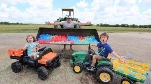 'Filling our tractors with TONS of water balloons | Tractors for kids'