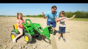 'Using our kids tractors to dig dirt and save a stuck real tractor | Tractors for kids'