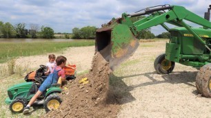 'Playing in the dirt and getting stuck in the mud | Tractors for kids'