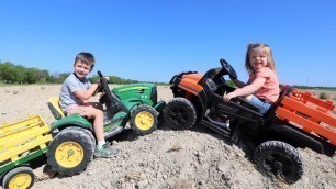 'Using kids tractors to move dirt into the water | Tractors for kids'