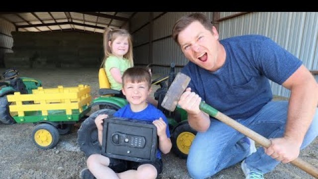 'Using kids tractors to open mystery safe on the farm | Tractors for kids'