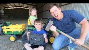 'Using kids tractors to open mystery safe on the farm | Tractors for kids'