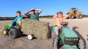'Using kids tractors to move hay and rocks on the farm | Tractors for kids'