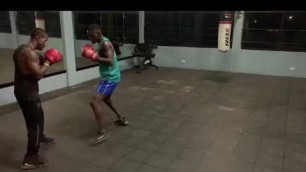 'Ninja the boxer working on the pads with coach Otis at vibe fitness.'