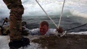 'British Royal Marines Commandos train US Marines to survive in freezing water.'